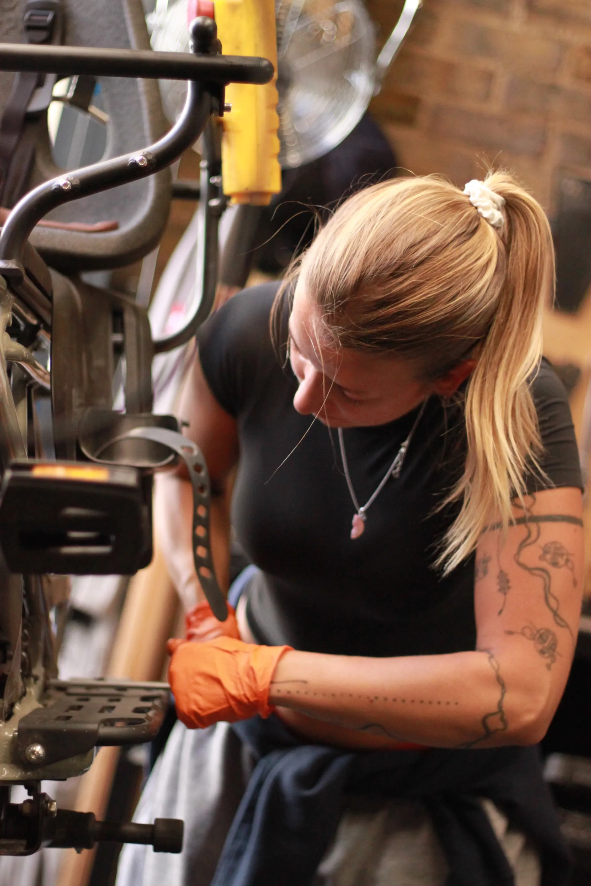Mechanic repairing a bicycle at London Bike Studio